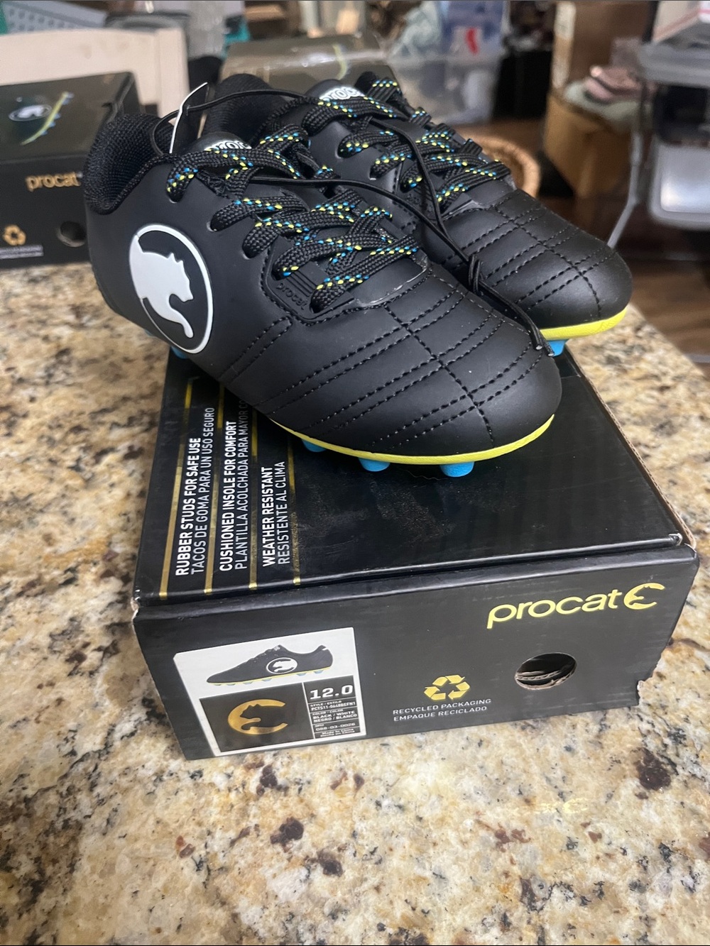 Puma Kids' Black Soccer Cleats with Neon Yellow and Blue Studs
